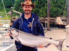 Happy angler with chinook salmon